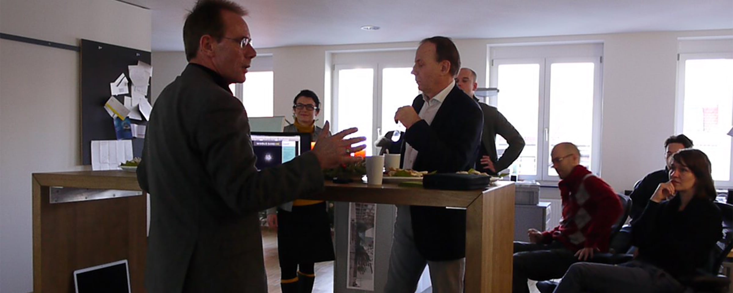 Peter Rosenfeld and Dr. Jürgen Willrodt speak at Intuity office