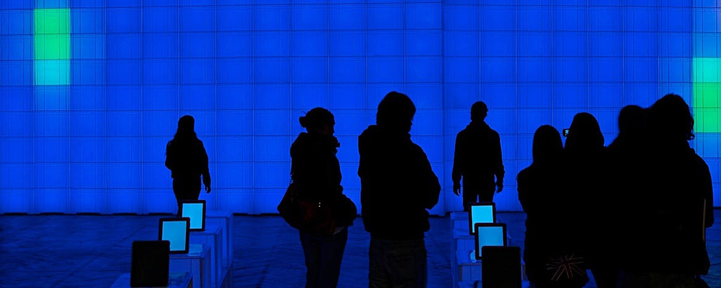 Persons in an exhibition on the subject of architecture